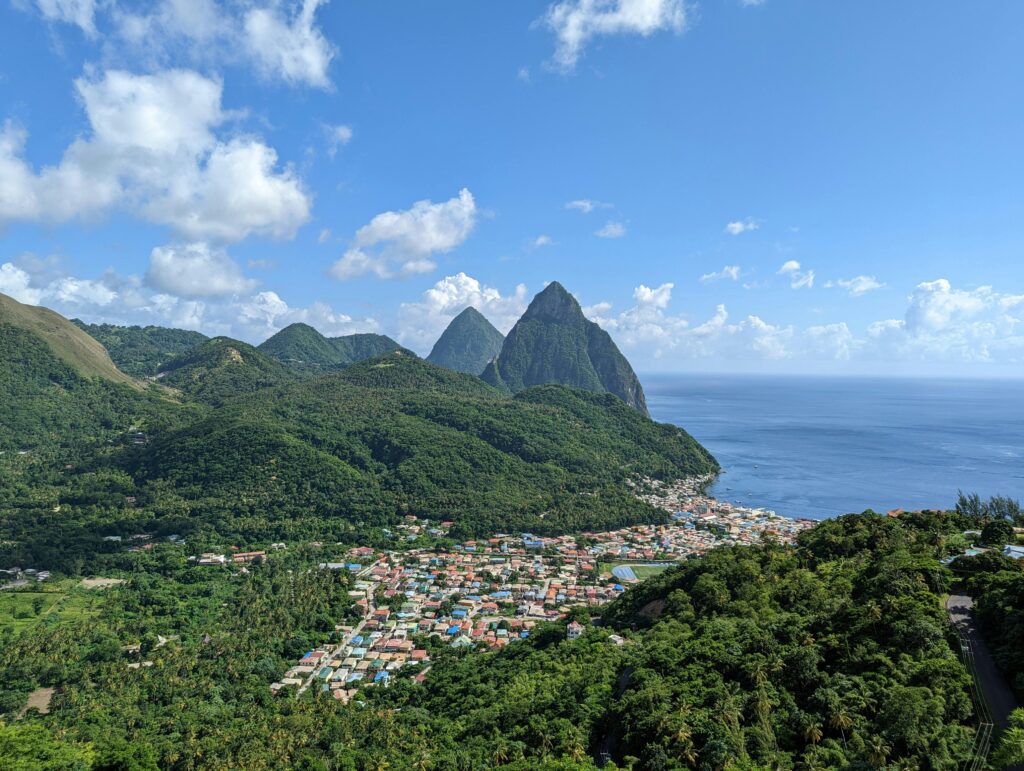 Stunning aerial view of Soufriere town and the iconic Pitons in Saint Lucia.