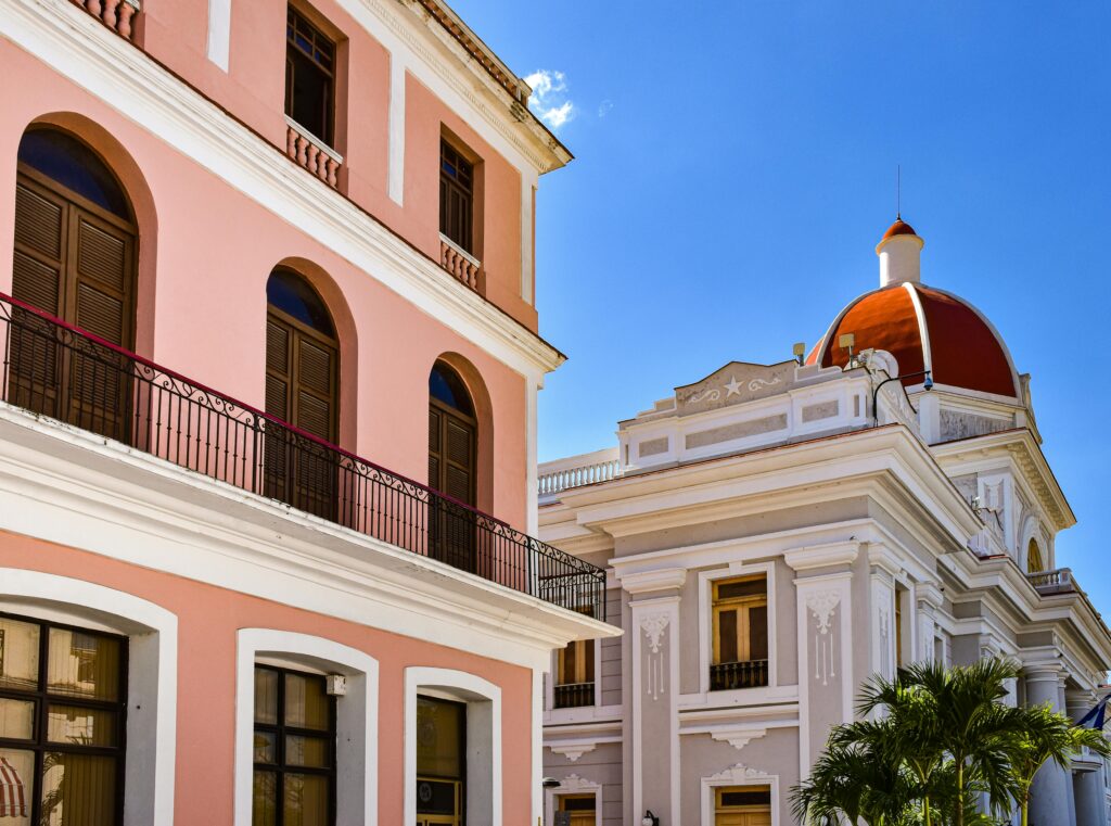 Elegant colonial buildings with vibrant colors in Cienfuegos, Cuba.