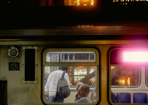 pexels-photo-34436905-34436905 Capturing a train at night with the iconic Chicago sign glowing in the background, creating a nostalgic urban vibe.
